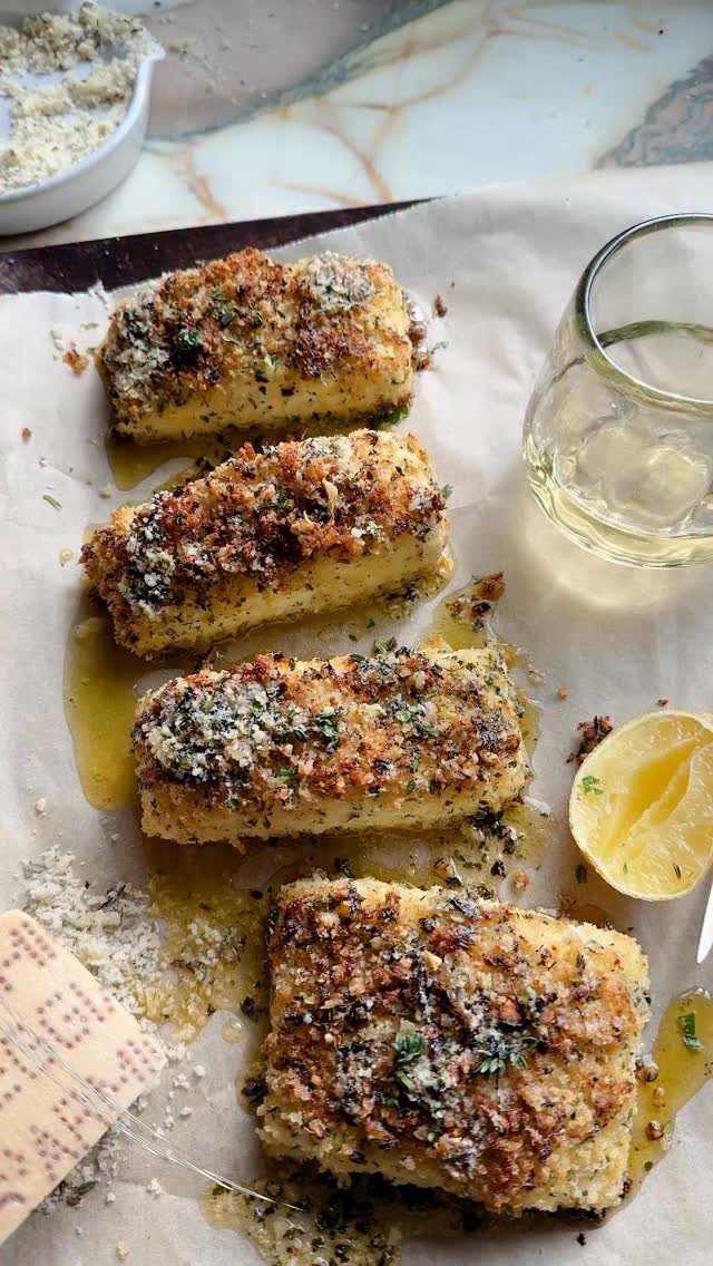 Four breaded halibut fillets with garlic butter crust, lemon, and white wine.
