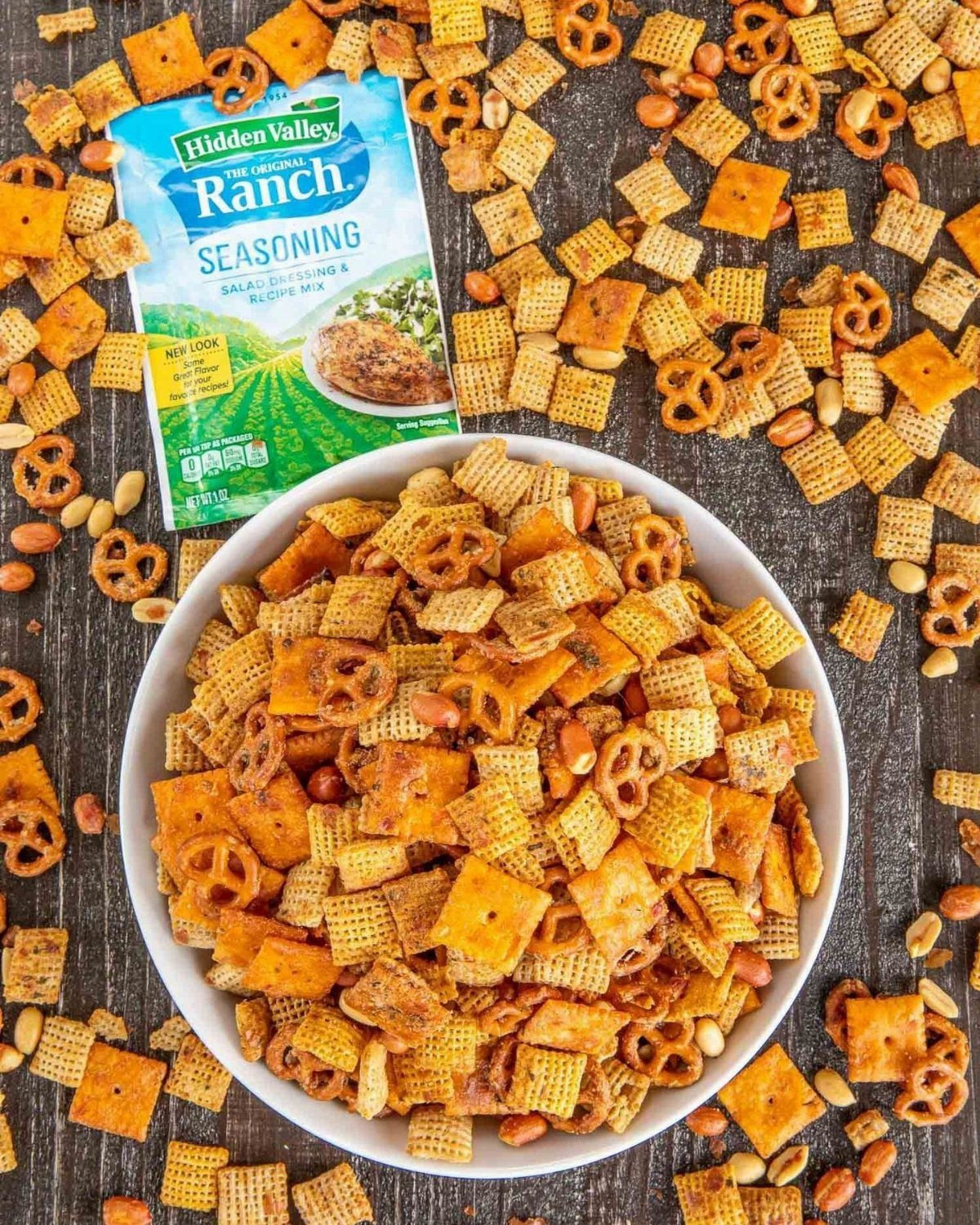 Savory snack mix with pretzels and cereal in a bowl with ranch seasoning.