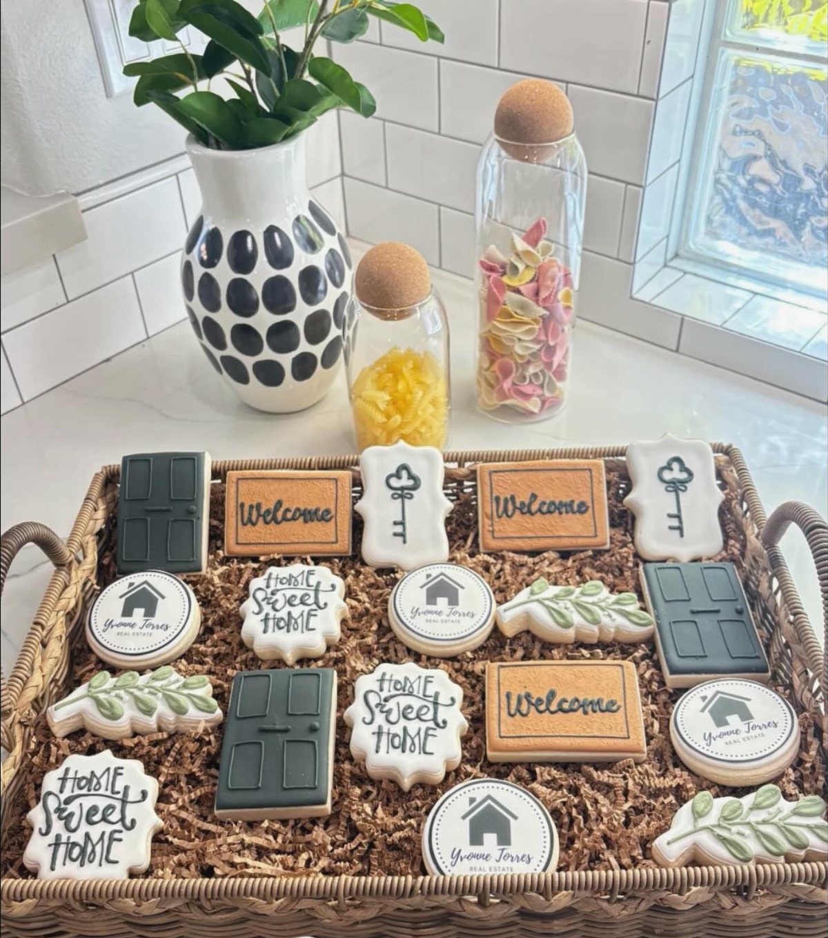 Decorated sugar cookies shaped like doors and keys in a wicker basket.