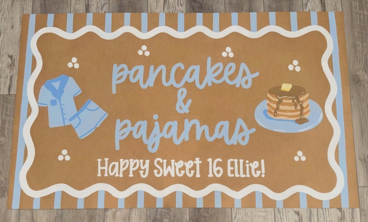 Brown welcome mat with pancakes and pajamas theme for a sweet 16 party.