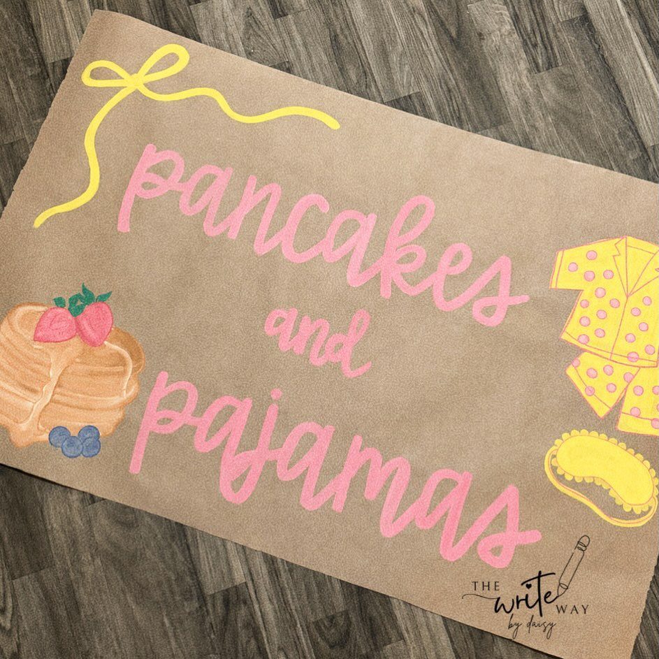 Brown paper invitation with pink text and illustrations of pancakes and pajamas.
