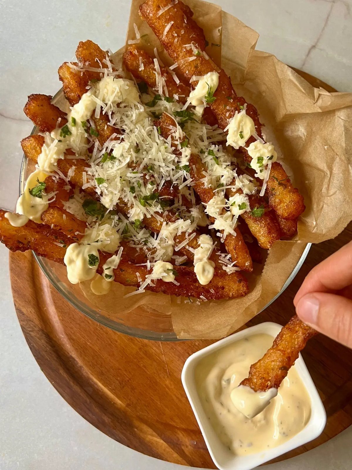 Breaded fish sticks topped with parmesan and parsley with a creamy dipping sauce.
