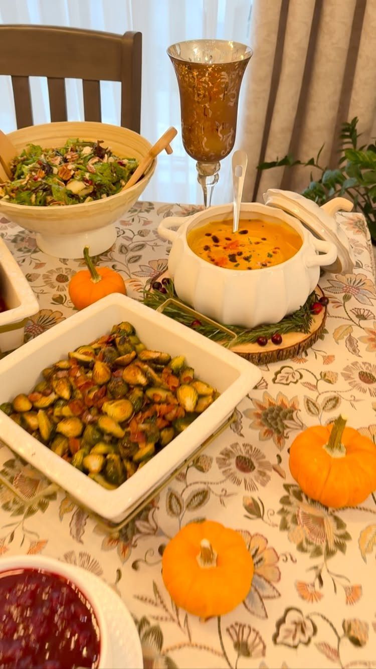 Thanksgiving feast with Brussels sprouts, soup in a pumpkin tureen, and mini pumpkins.